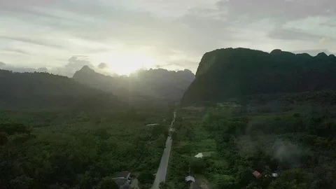 Drone Shot Of Sunset Behind Mountain Khao Sok National Park - Thailand 4k Stock Footage 150160077