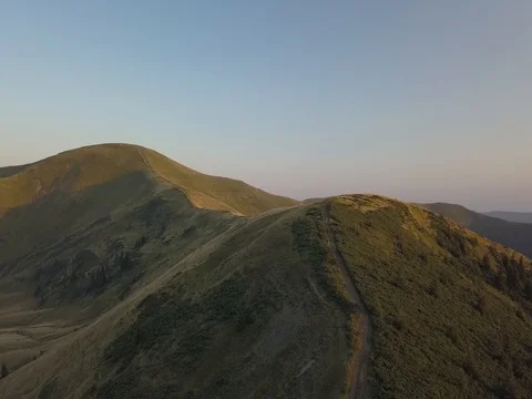 Drone shot: Sunset lits mountain ridge of Carpathian mountains, Ukraine Stock Footage 81911304