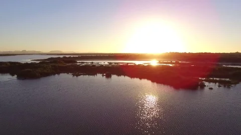 DRONE SHOT SUNSET MARSH ASCEND Stock Footage 73940658