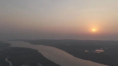 Drone Shot of Sunset Over Gorai Creek, Mumbai – Golden Hour Aerial View Stock Footage 307771795