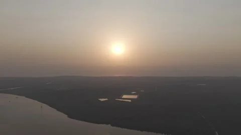 Drone Shot of Sunset Over Scenic Landscape – Golden Hour Aerial Footage Stock Footage 307769409