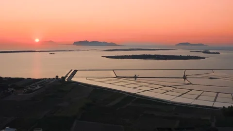 Drone shot of of sunset in Saline di Marsala, Salt pans in Sicily Italy 4K Video stock 162946586