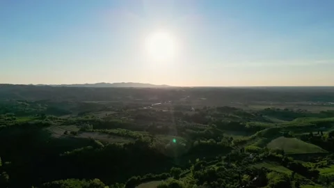 Drone shot of sunset trees, mountains and blue sky in the hills Tuscany Stock Footage 213200904