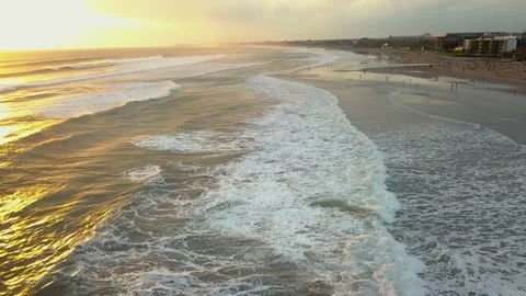 Drone shot of Sunset as waves break in the Indian Ocean. Sunset over ocean waves Video stock 221086377