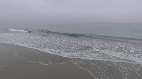 Drone shot of Surfers in the ocean-Waves beach Stock Footage 54569965