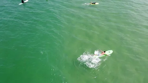 Drone shot of surfers in sea Stock Footage