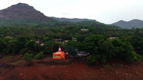 Drone shot of temple at the base of a mountain 4K30 스톡 동영상 332893339