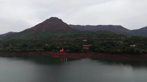 Drone shot of temple at the base of a mountain 4K30 스톡 동영상 332893346