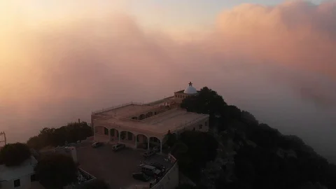 Drone shot of temple in cloudy sunset mountains Stock Footage 96254107
