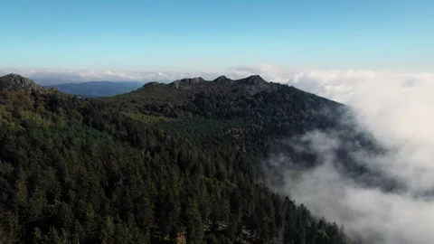 Drone shot through clouds revealing the pic des trois dents in Le Pilat 库存影片 263403115