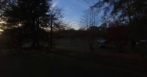 Drone shot through trees at sunset Stock Footage 91474509