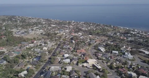 Drone shot tilting down over Marino and the southern suburb property of Adelaide Stock Footage 108370048