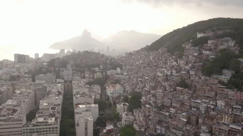 Drone shot tilting down to reveal favelas and building in Rio De Janeiro, Stock Footage