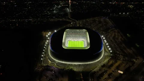 Drone shot tilting over the night lit BBVA stadium, in Monterrey city, Vídeos de archivo 236540770