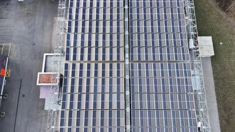 Drone shot from top down rising above photovoltaic panels 스톡 동영상 330015682