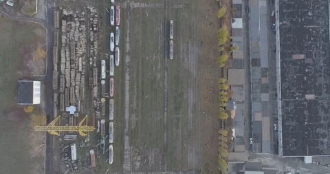 Drone shot: Top down shot of tram depo with many trams. Kharkiv, Ukraine. Stock Footage 93847504