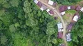 Drone shot top view aerial follow footpath jungle mountain village buildings 4k or 4k+ Resolution