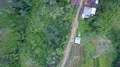 Drone shot top view aerial follow footpath jungle mountain village buildings 4k or 4k+ Resolution
