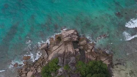 Drone shot: Top view of rock formation on Seychelles 動画素材 105354081