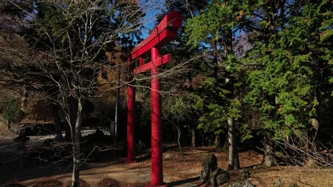 Drone shot of Torii gate with forest and Fuji mountain with blue sky, Japan Stock Footage 122572326