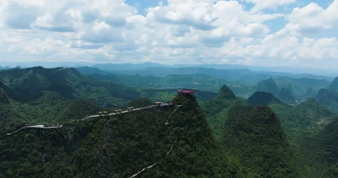 Drone shot toward the Ruyi cloud top platform surrounded by karst mountains Stock Footage 346114102
