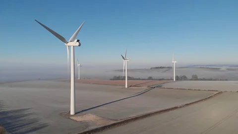 Drone shot towards four wind turbines 库存影片 104918539
