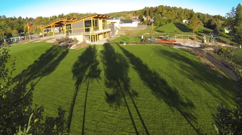 Drone shot of a town building next to a park Stock Footage 63865491