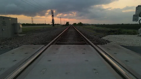 Drone Shot Tracking Low Just Above Railroad Tracks After Sunset In Texas, Stock Footage 188435745