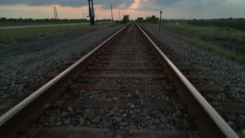 Drone Shot Tracking Very Low Over Railroad Track And Lifting Up High Over Stock Footage 188436156