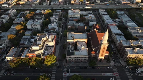 Drone shot of traffic passing through Brooklyn at sunrise Video stock 253877607