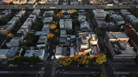 Drone shot of traffic passing through Brooklyn at sunrise Video stock 253878085