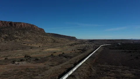 Drone shot of a train in the desert in El Paso, Texas Stock Footage 128656402
