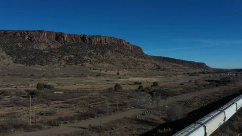 Drone shot of a train in the desert in El Paso, Texas Stock Footage 128656420