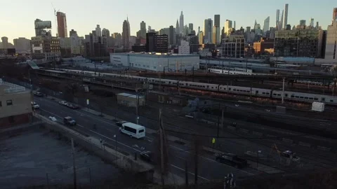 Drone shot of a train in long island city heading for NYC Stock Footage 144841475