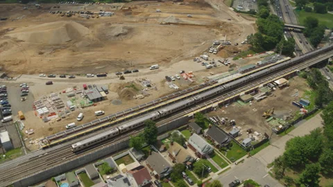 Drone Shot of Train Passing Through UBS Arena Contruction Site at Belmont Park Video stock 235504039