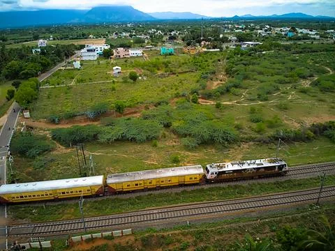 Drone shot of train passing through track 写真素材