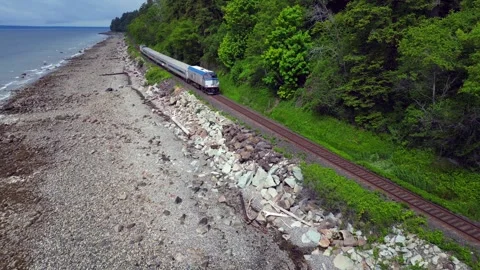 Drone shot, train pulls away at White Rock beach Stock Footage 344900298