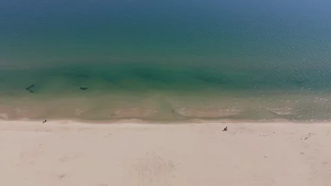 Drone shot of tranquil ocean waves and empty sandy shore Stock-Footage 332247367