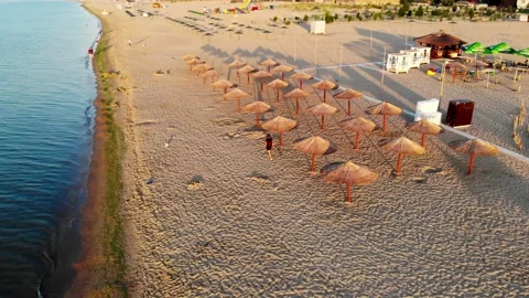 Drone shot of a treasure hunter on the beach looking for treasure Stock Footage 169093410