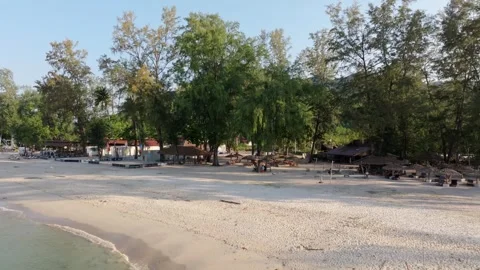 Drone shot of turquoise waves lapping Klong Prao shoreline, Koh Chang, Thailand Stock Footage 310389908