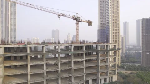 Drone shot of under construction building with tower crane mounted, Mumbai Stock Footage 337222839