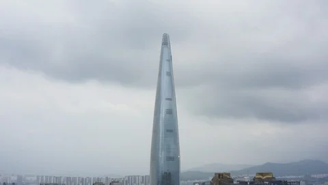 Drone shot of upper half famous Seoul tower in Korea under cloudy sky Video stock 126613215