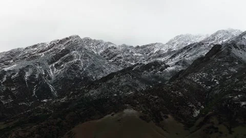 Drone shot of Utah's foothills covered with a light dusting of Spring snow. Stock Footage 341484748