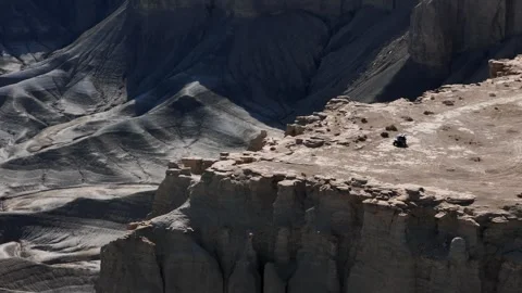 Drone Shot of UTV Vehicle Moving Near Cliff Edge, Moonscape Overlook, Utah USA Stock Footage 320383344