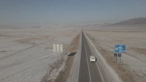 Drone shot of van driving along single road, Mongolia Stock Footage 244136352