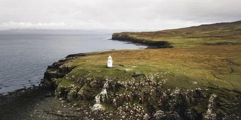 Drone shot of Vaternish Lighthouse at Isle of Skye, Scotland 스톡 사진