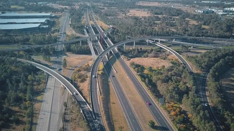 Drone shot of vehicles driving on the multi lane highway in the city Stock Footage 122404073