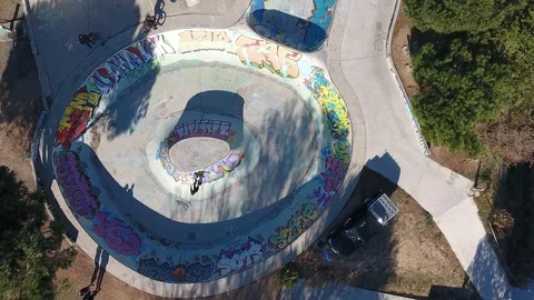 Drone shot vertical top view over a skatepark in south of France. Young Bmx ride Stock Footage 90744753
