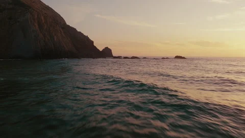 Drone shot very close above water sunset Castelejo Portugal waves breaking Video stock 196145124