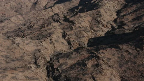 Drone shot view of bumpy, hilly terrain 스톡 동영상 191126001